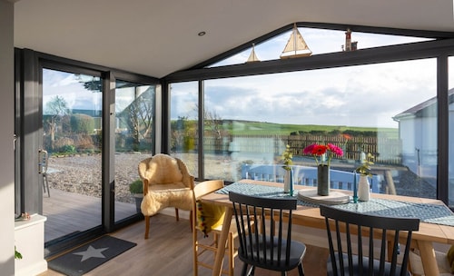 A perfectly reclaimed cottage with uninterrupted views of the Atlantic Ocean....