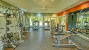 A gym with treadmills, weight machines, and a mirrored wall. - Relaxation (Montego Bay)
