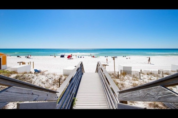 White sand private beach and Emerald water just outside building