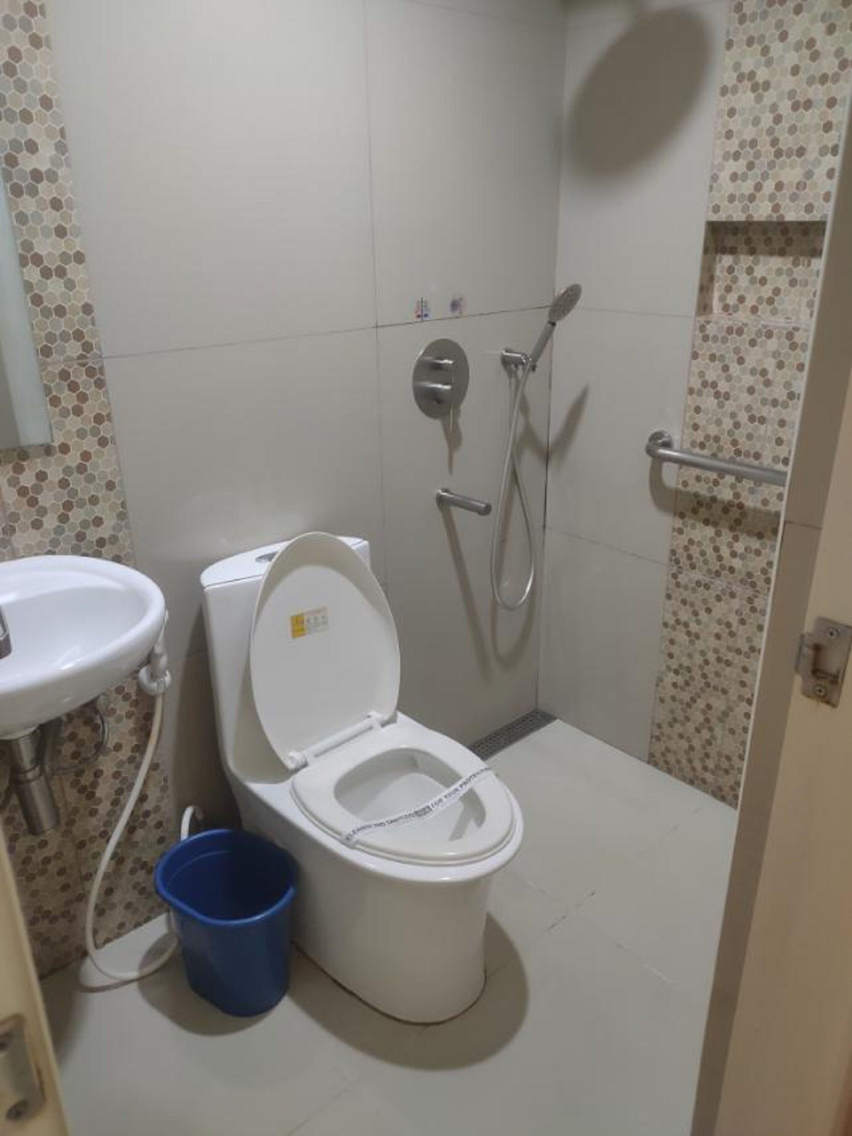 deluxe room | bathroom | shower, rainfall showerhead, free toiletries, soap