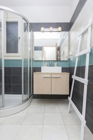 Shower, hair dryer, towels, soap