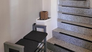A staircase with a handrail and a heart-shaped decoration.