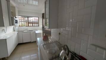 Fridge, microwave, electric kettle, toaster