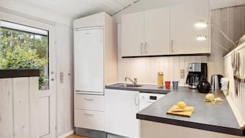 Fridge, stovetop, dishwasher, coffee/tea maker