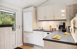 Fridge, stovetop, dishwasher, coffee/tea maker