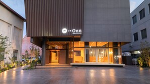 A modern building with a prominent sign for 'Onn NAKATSUGAWA'. - OnnNakatsugawa (Nakatsugawa)