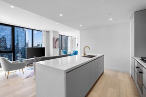 Three Bedroom Two Bathroom Apartment | Living area | 50-inch LCD TV with digital channels, TV