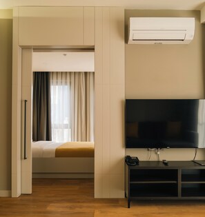 Deluxe Suite | Premium bedding, in-room safe, desk, laptop workspace