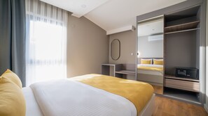 Junior Suite | 1 bilik tidur, peralatan tempat tidur premium, peti besi dalam bilik