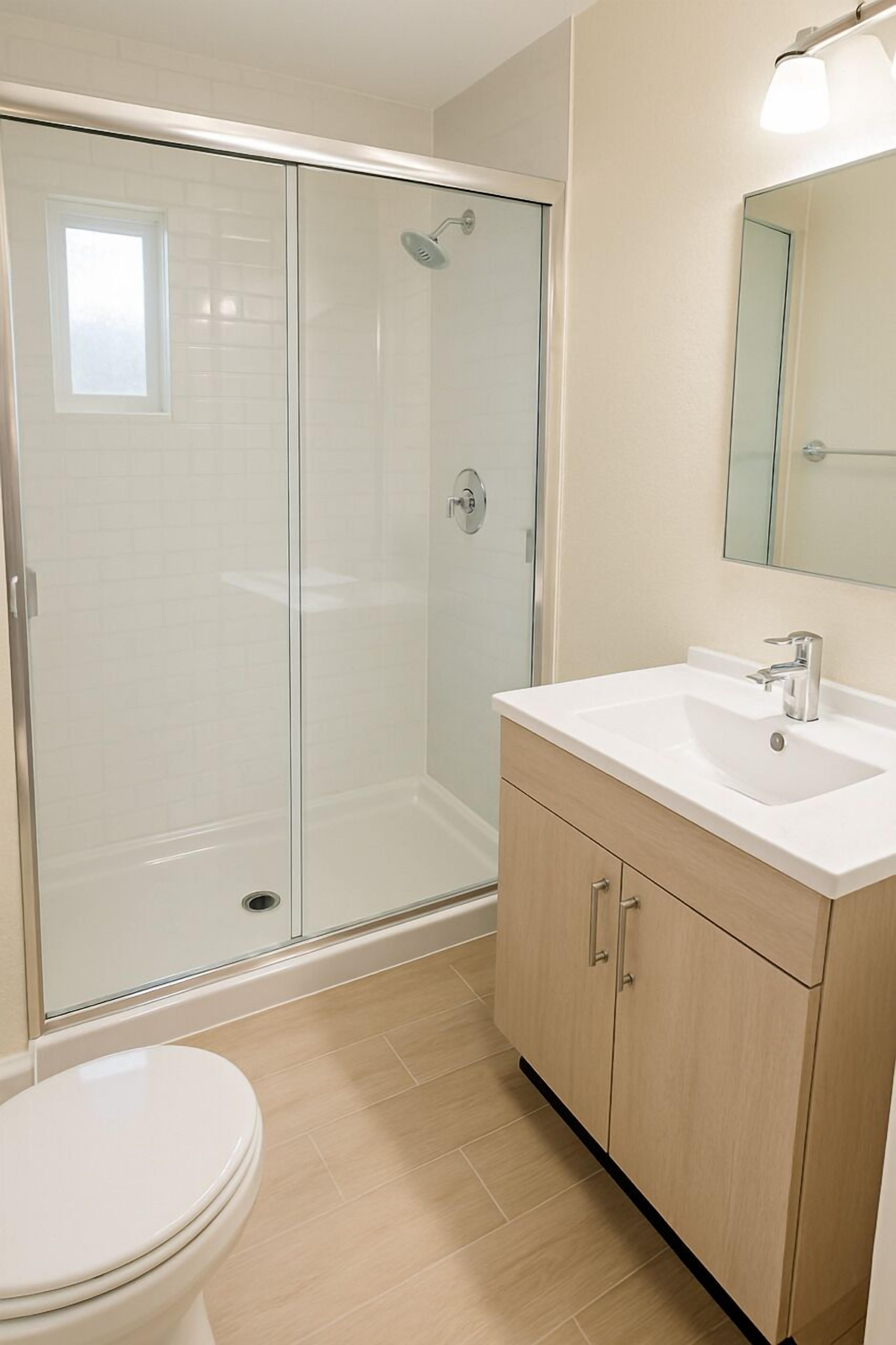 Family Room | Bathroom | Designer toiletries, hair dryer, towels, soap