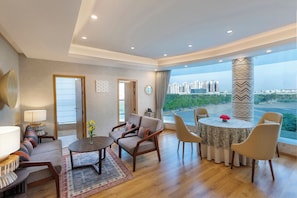 Presidential Suite | Living area | 40-inch Smart TV with digital channels, TV - ExpoInn Suites and Convention (Greater Noida)