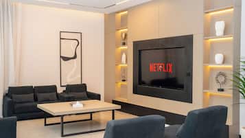 Economy Villa | Living room | 60-inch Smart TV with satellite channels