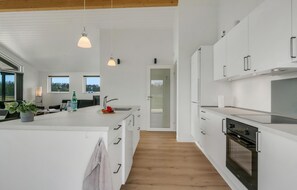 Fridge, stovetop, dishwasher, coffee/tea maker