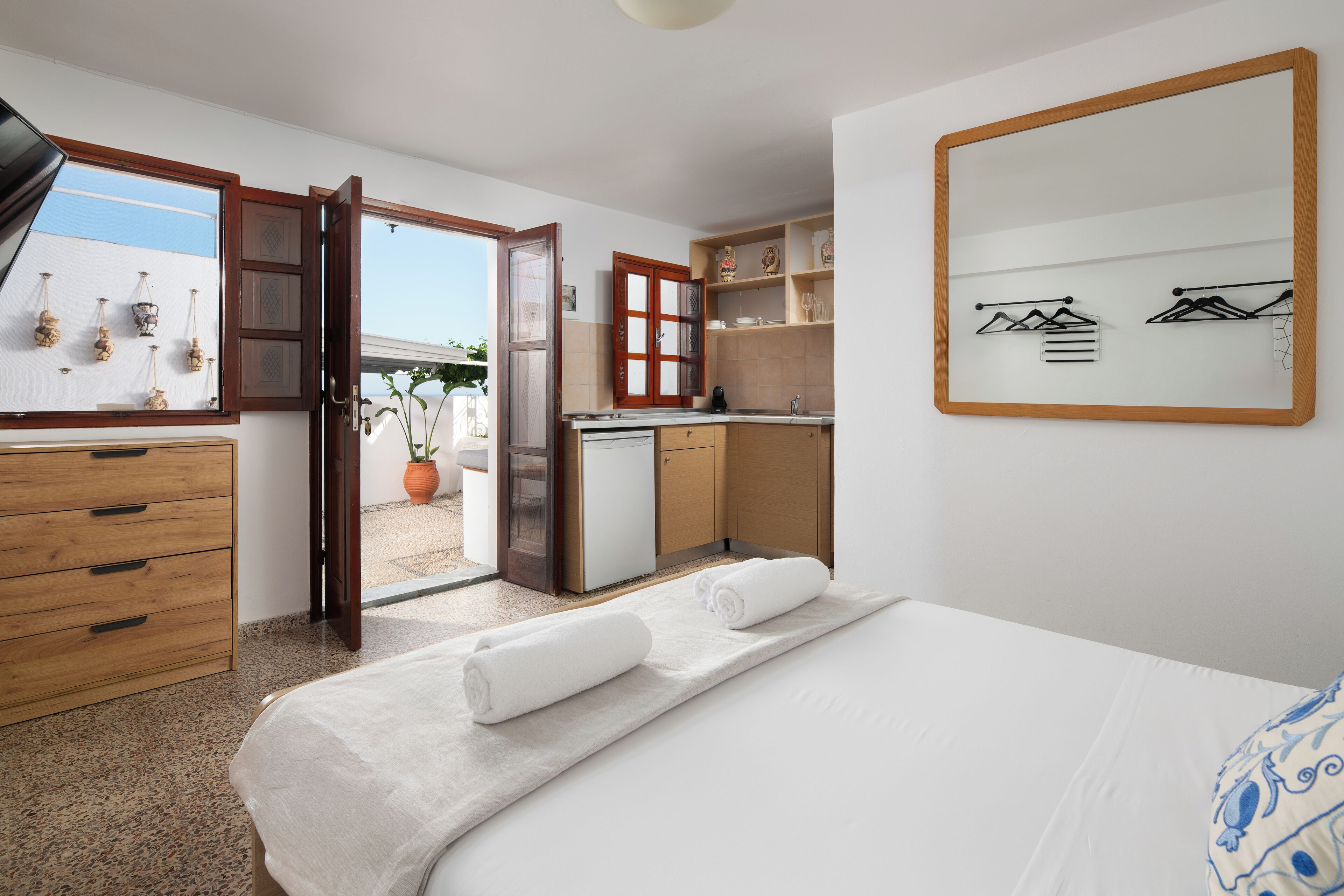 One Bedroom Suite with Patio | In-room safe, laptop workspace, blackout drapes, iron/ironing board