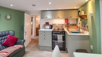 Fridge, electric kettle, toaster, cookware/dishes/utensils
