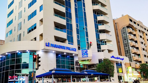 A multi-story hotel with a prominent sign reading "Lé Paradise Palace". - Le Paradise Palace Hotel Deira Dubai Al Rigga (Dubai)