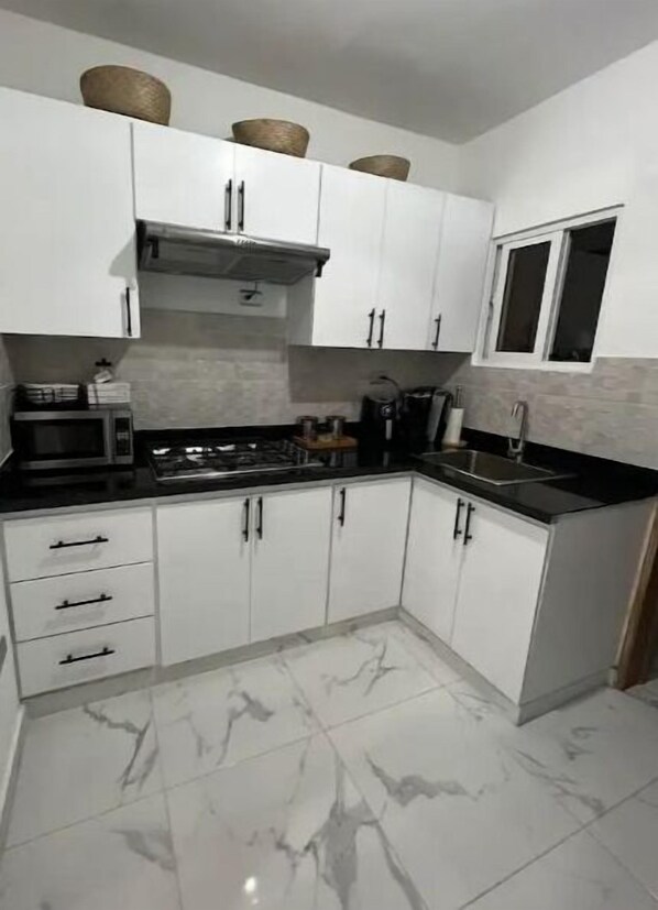 Fridge, microwave, stovetop, coffee/tea maker