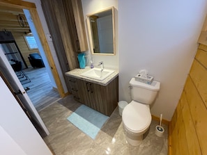 Shower, hair dryer, towels, toilet paper