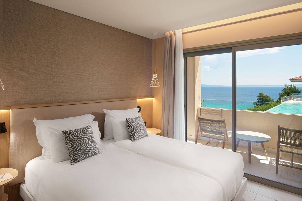 Premium bedding, down duvets, memory-foam beds, in-room safe