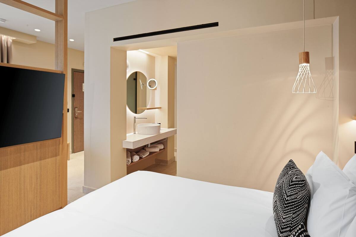 Premium bedding, down duvets, memory-foam beds, in-room safe