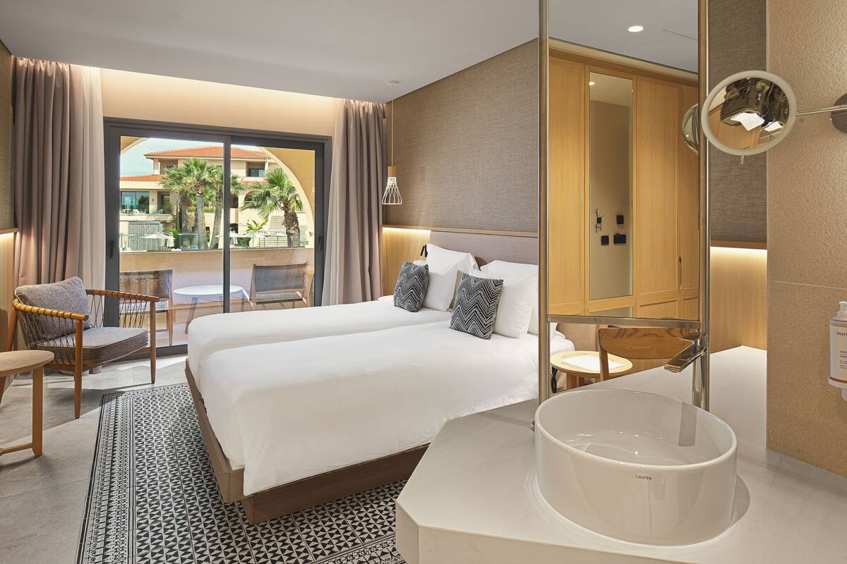 Premium bedding, down duvets, memory-foam beds, in-room safe