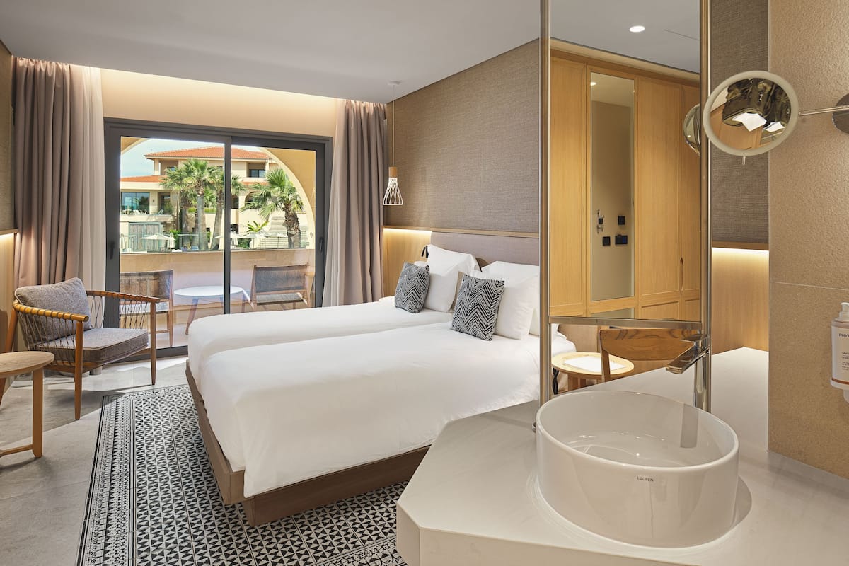 Deluxe Double Room Partial Sea View | Premium bedding, down comforters, memory foam beds, in-room safe