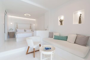 Deluxe Suite | Living area | 40-inch Smart TV with satellite channels, TV