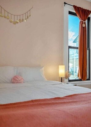 4 bedrooms, memory-foam beds, iron/ironing board, travel cot