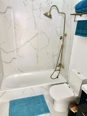 Shower, hair dryer, towels, soap