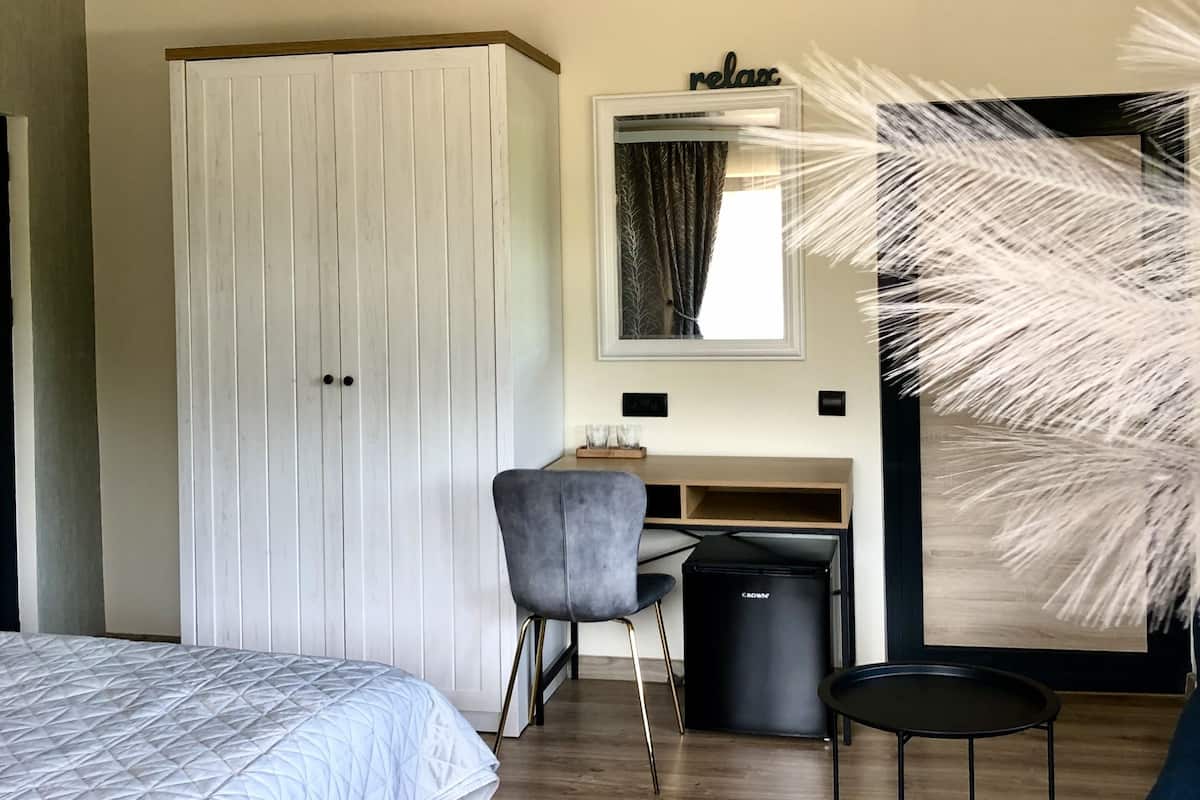 Memory-foam beds, minibar, desk, laptop workspace