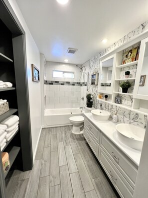 Shower, hair dryer, towels, soap