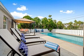 A heated pool, pool loungers