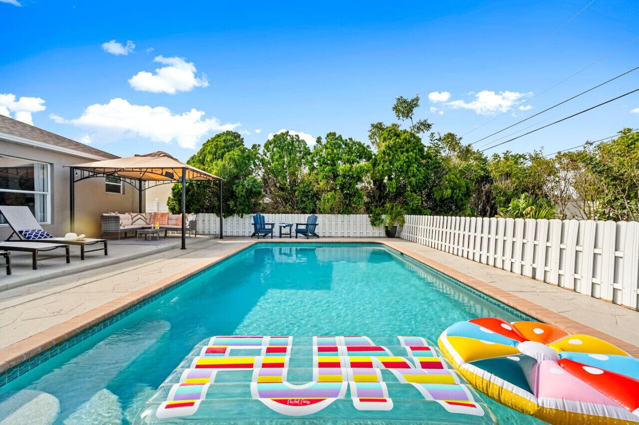 A heated pool, sun loungers