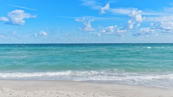 On the beach, white sand, beach towels