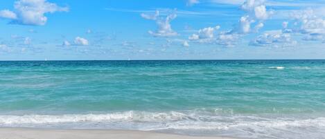 On the beach, white sand, beach towels