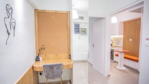 A modern bathroom with a wooden vanity, a towel rack, and a shower area. - 350m from museum of Acropolis a cozy & quit house (Αθήνα)
