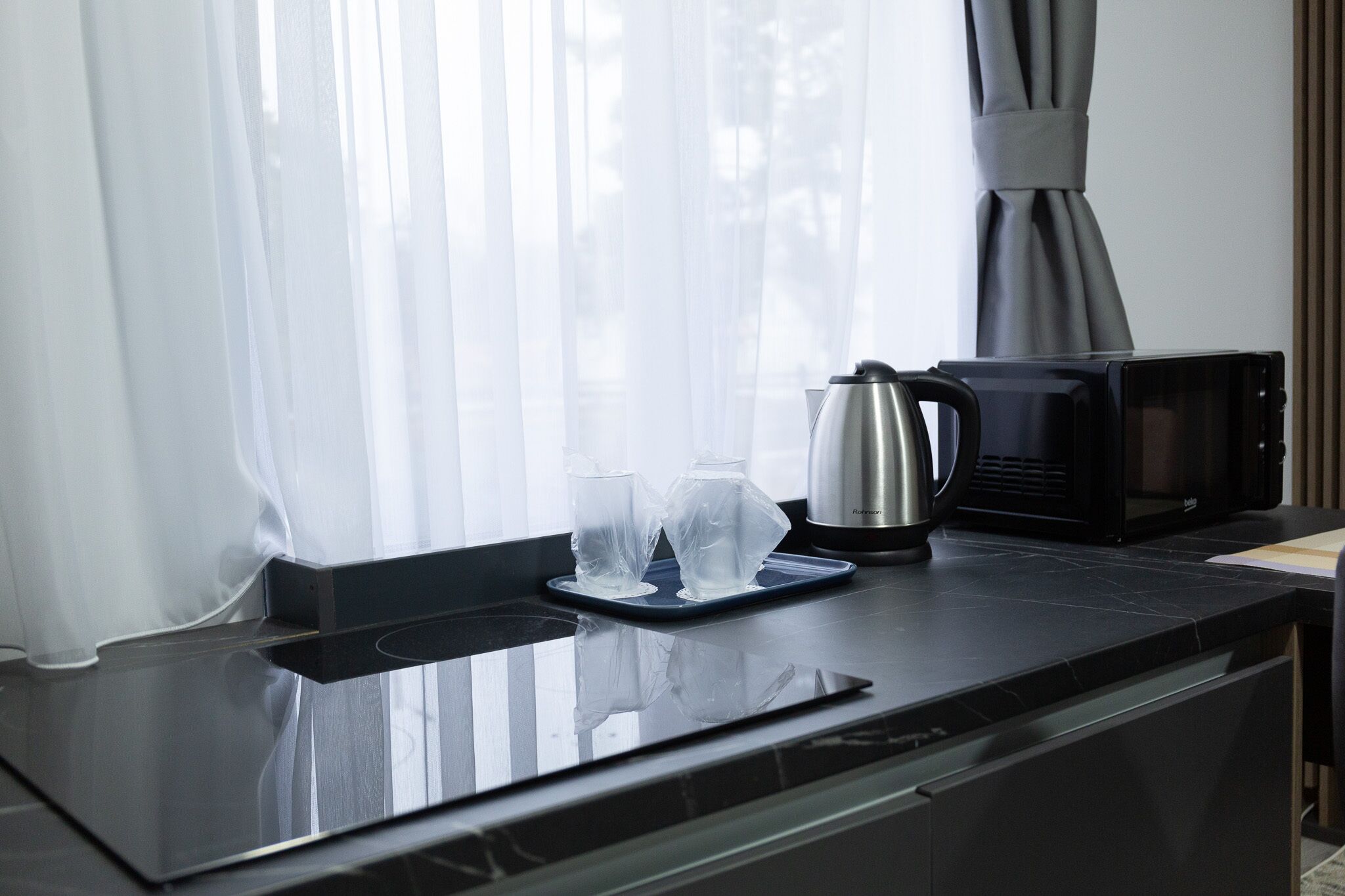 Family Suite | Private kitchen | Fridge, microwave, coffee/tea maker, dining tables