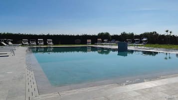 Seasonal outdoor pool, pool umbrellas, sun loungers
