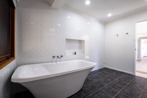 Bathtub, hair dryer, towels