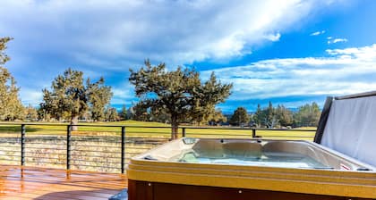 Golf course-front home with deck, hot tub, fireplace, W/D, & community pool