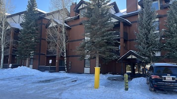 A multi-story hotel with a modern architectural design, featuring large windows and balconies.