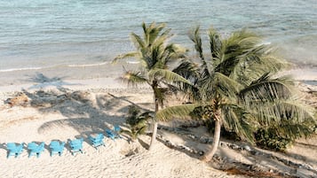 On the beach, sun-loungers, beach towels