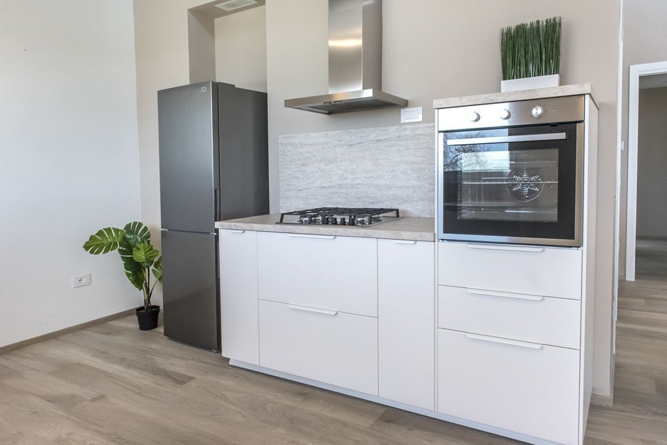 Fridge, oven, dishwasher, dining tables