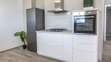 Fridge, oven, dishwasher, dining tables