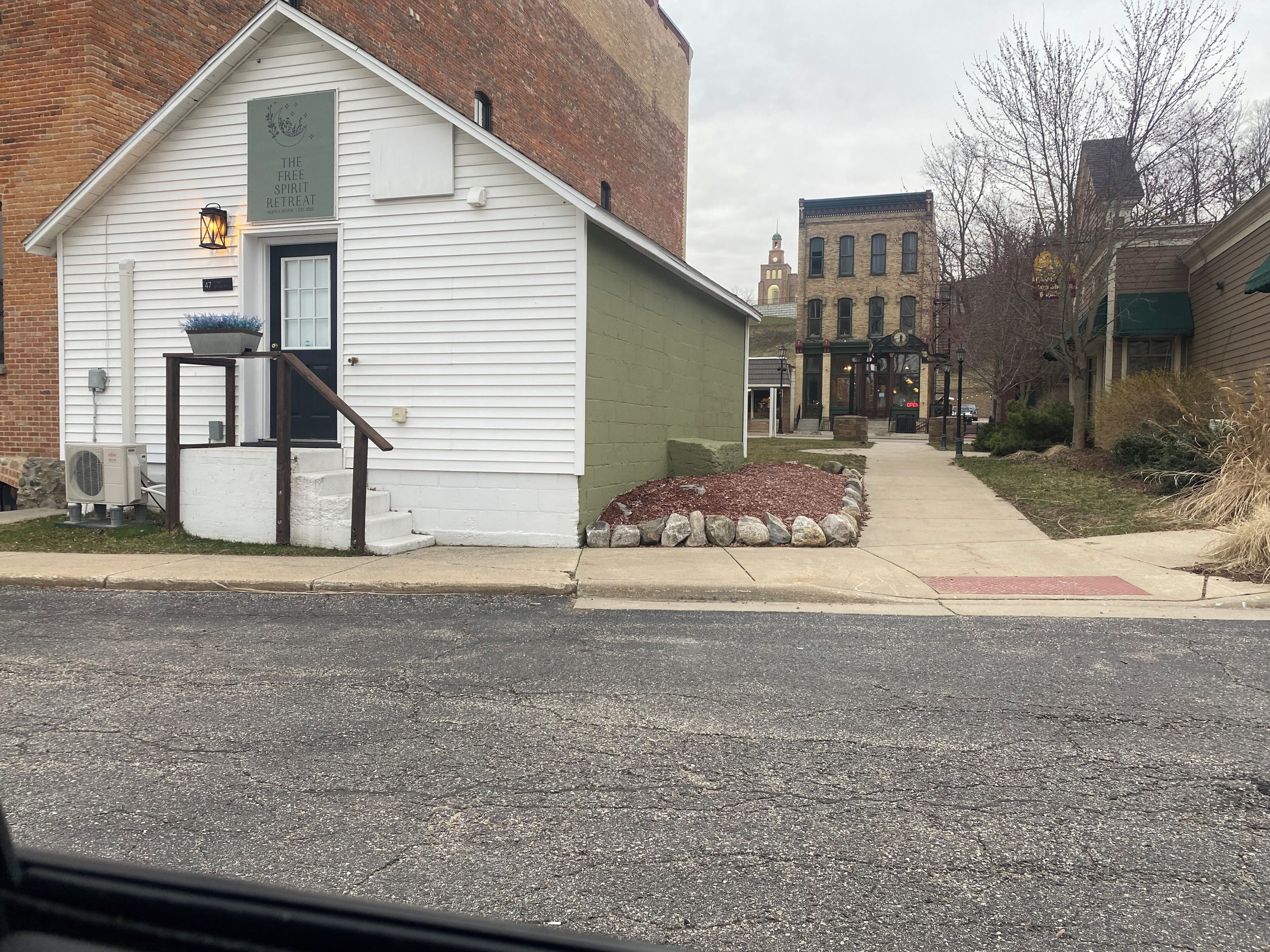 A building with a sign reading 'The Free Spirit Retreat.'