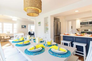 A modern kitchen with a stainless steel refrigerator, a microwave, and a stove. - Gorgeous Home with Game Room Dog Welcome! (Chatham)