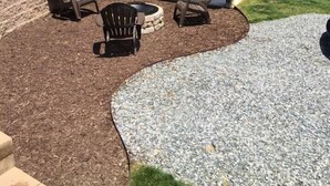 A house with a covered patio area featuring outdoor furniture and a fire pit. - Downtown Bryson City Flat - Walk to it All! (Bryson City)