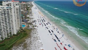 A beachside hotel with multiple floors, a pool, and a view of the ocean. - "Bay Watch" - AWESOME Condo with a water view and golf cart! (Miramar Beach)