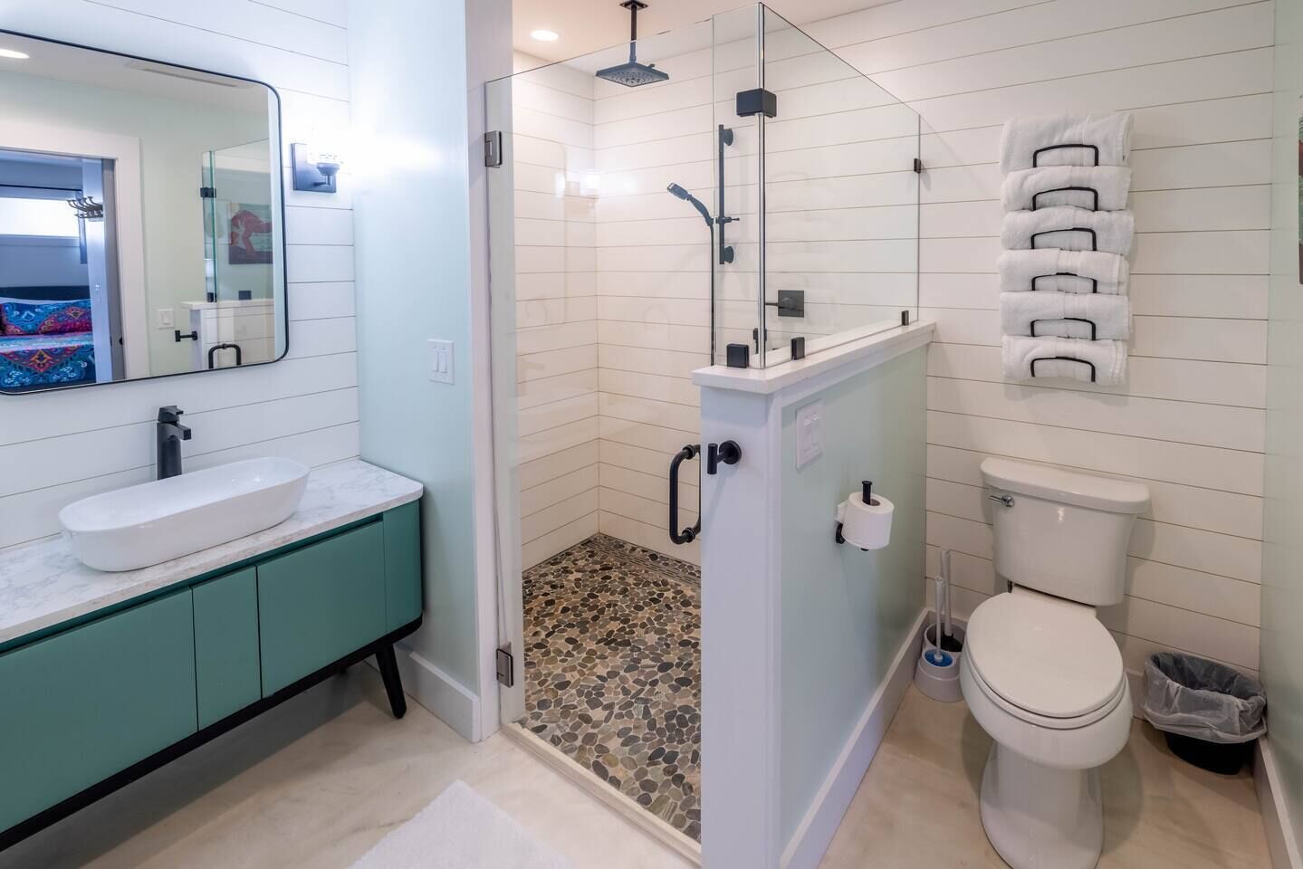 Shower, hair dryer, towels, toilet paper
