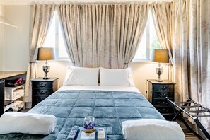 Chambre Ă©conomique | Minibar, systĂšme dâinsonorisation, fer et planche Ă repasser